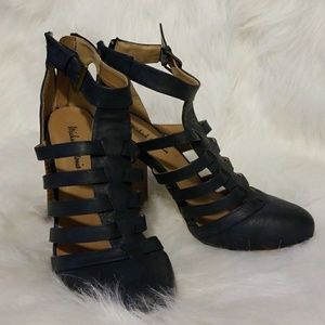 Navy closed toe caged heels